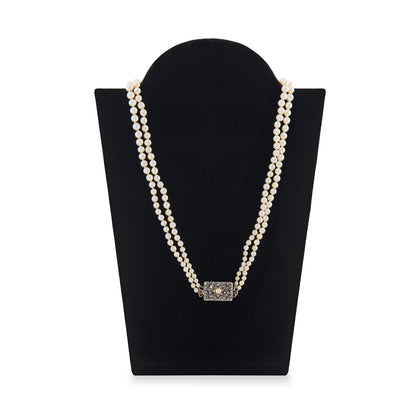 Beautiful pearl necklace consisting of two strands of creamy graduated seawater pearls, finished with a stunning vintage sterling silver, marcasite and seed pearl clasp. The pearls have a lovely lustre.