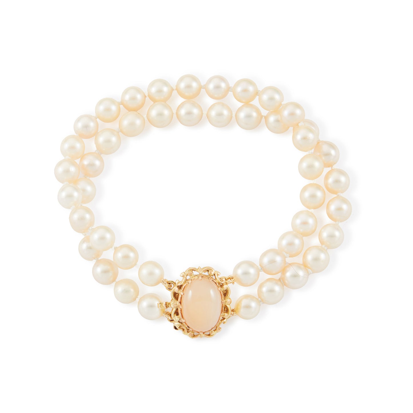 Lovely double strand bracelet consisting of lustrous cultured seawater pearls attached to a 9ct yellow gold and milky chalcedony clasp.