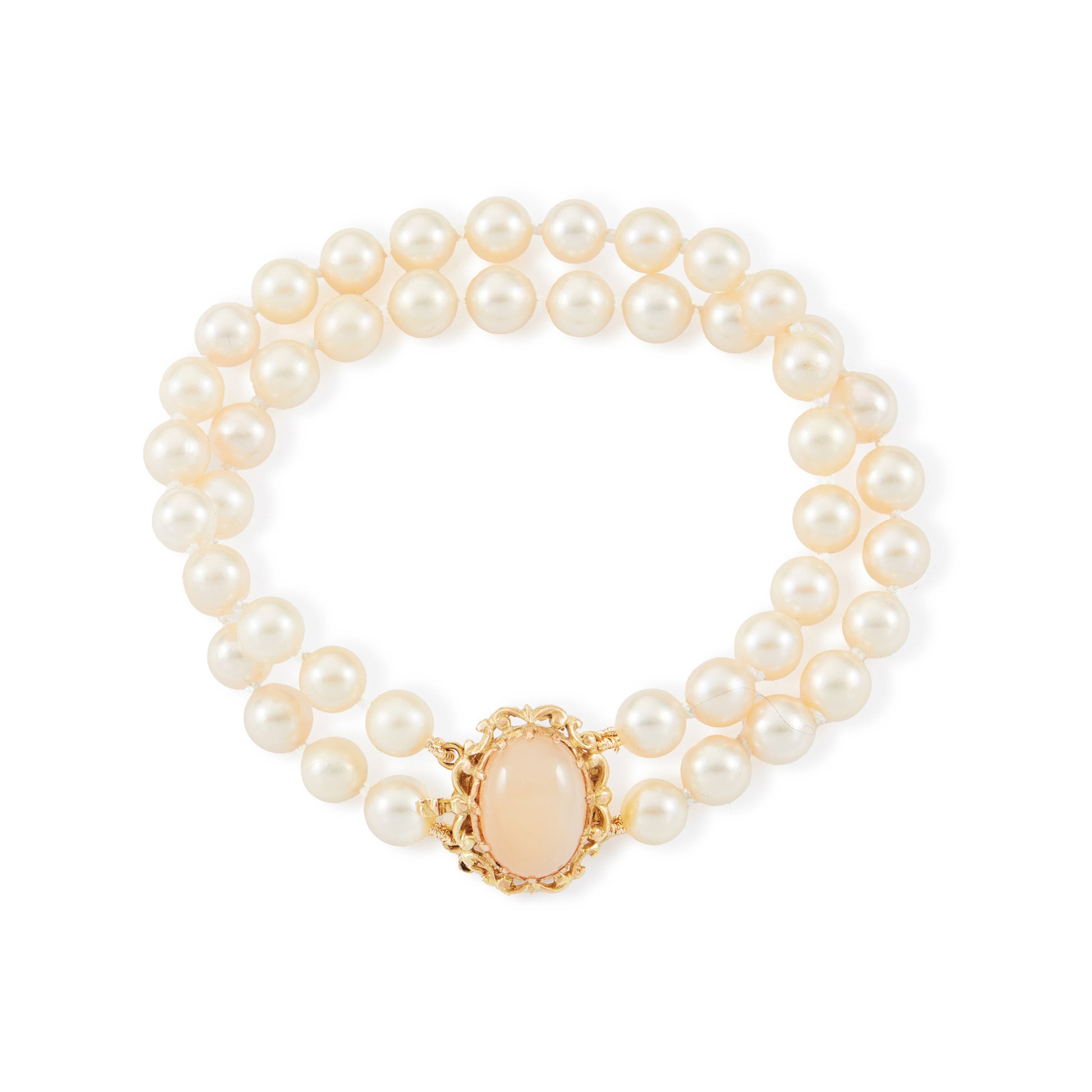 Lovely double strand bracelet consisting of lustrous cultured seawater pearls attached to a 9ct yellow gold and milky chalcedony clasp.