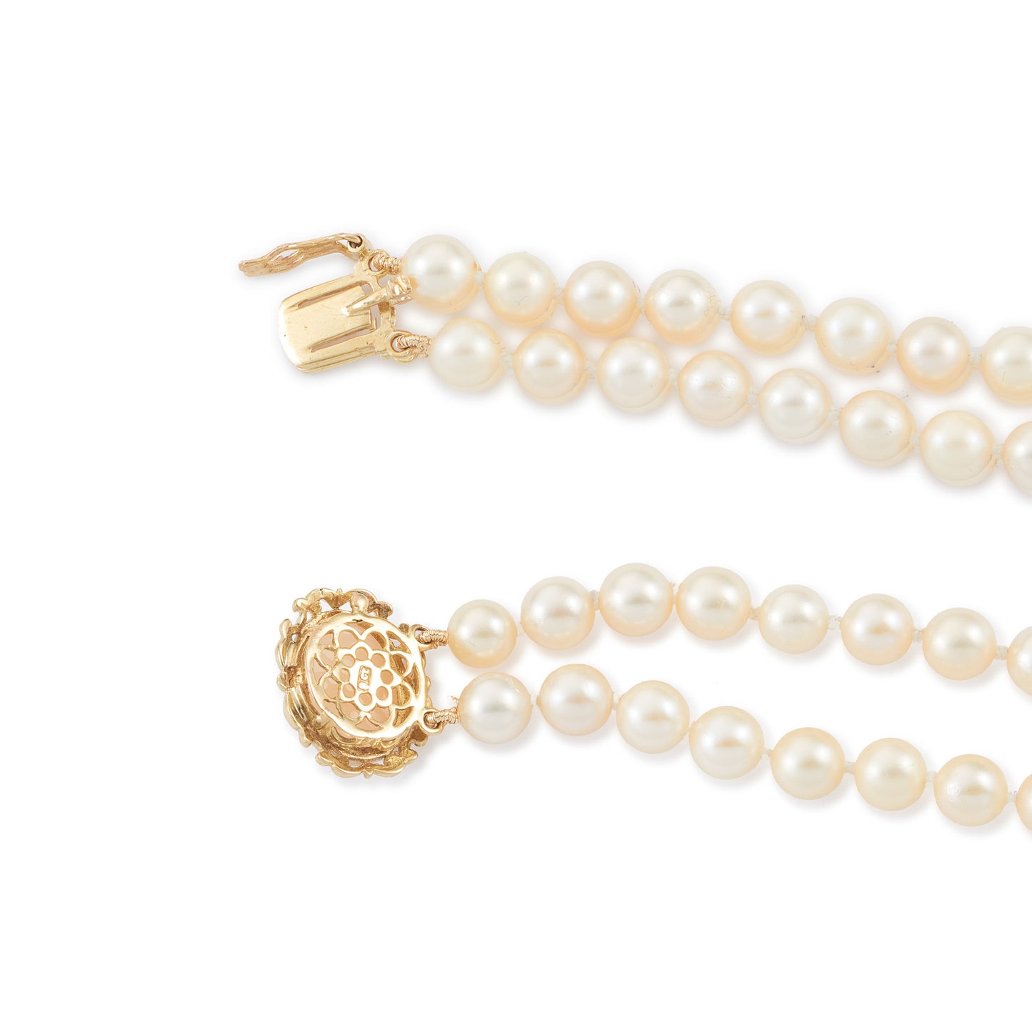 Lovely double strand bracelet consisting of lustrous cultured seawater pearls attached to a 9ct yellow gold and milky chalcedony clasp.