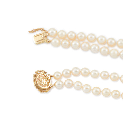 Lovely double strand bracelet consisting of lustrous cultured seawater pearls attached to a 9ct yellow gold and milky chalcedony clasp.