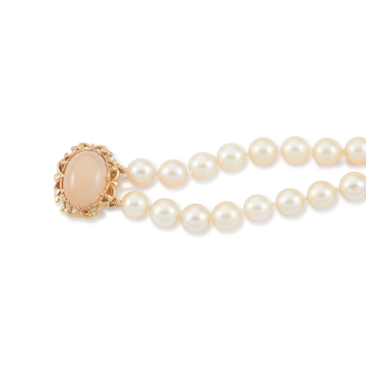 Lovely double strand bracelet consisting of lustrous cultured seawater pearls attached to a 9ct yellow gold and milky chalcedony clasp.
