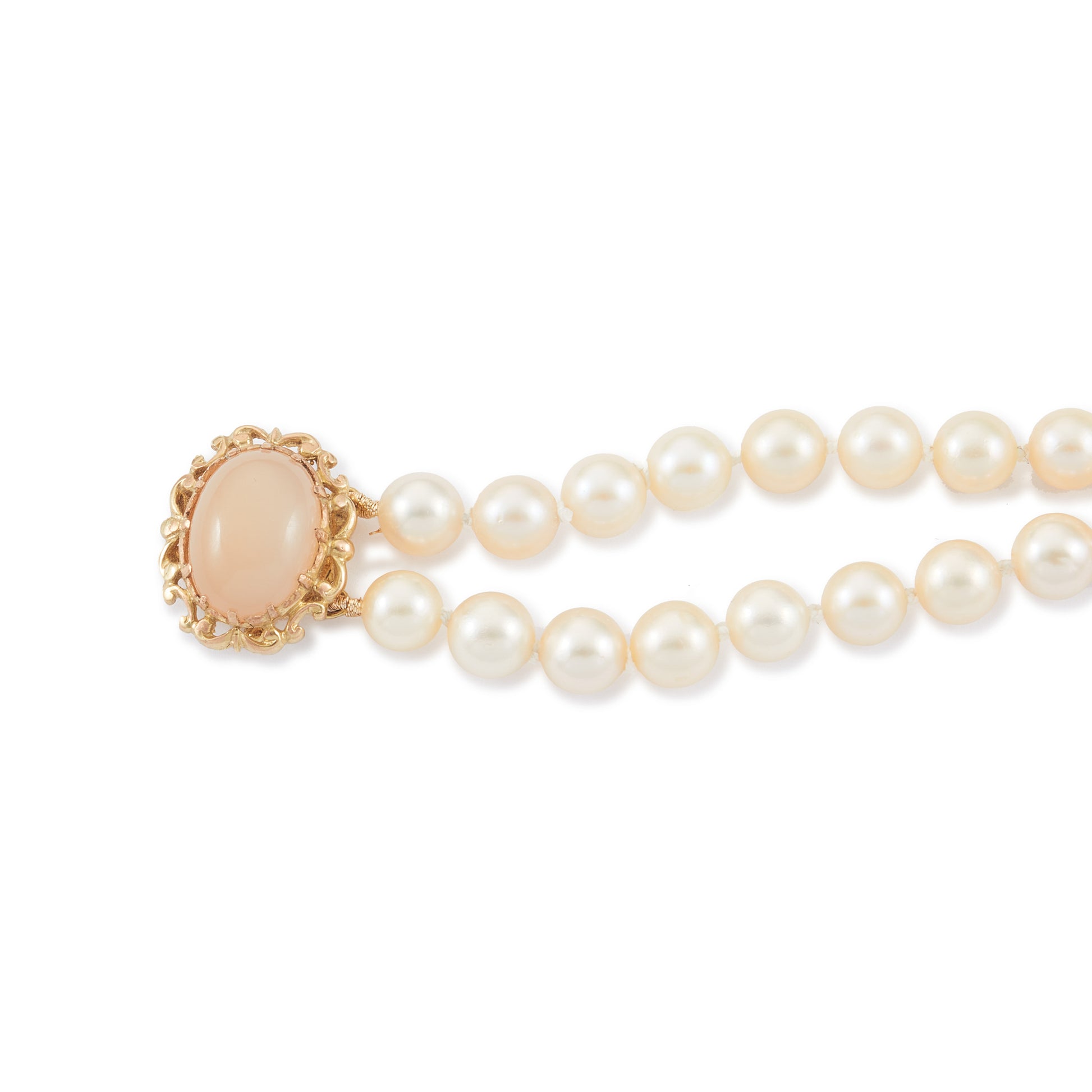 Lovely double strand bracelet consisting of lustrous cultured seawater pearls attached to a 9ct yellow gold and milky chalcedony clasp.