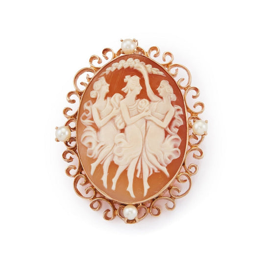 Charming Edwardian 10ct rose gold brooch depicting the Three Graces dancing merrily together. Surrounded by beautiful scrollwork and four pearls. Can also be worn as a pendant.