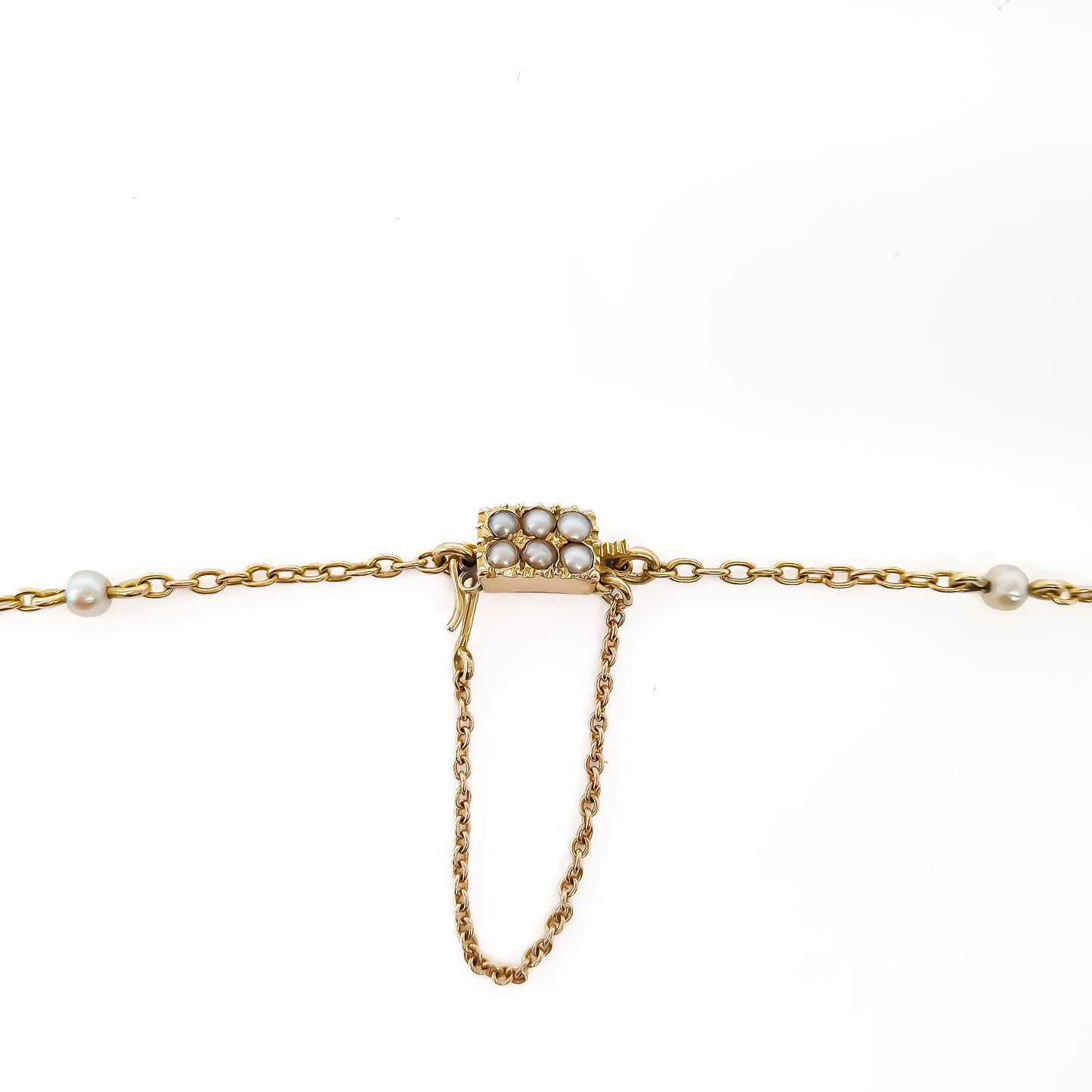 Stunning Edwardian 14ct yellow gold chain interspersed with graduating natural pearls and a larger pearl drop. Clasp attached to safety chain and set with six small seed pearls.
