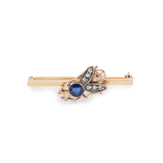 Charming 15ct yellow gold bar brooch featuring a quaint insect with a sapphire body and mine cut diamond eyes and wings.