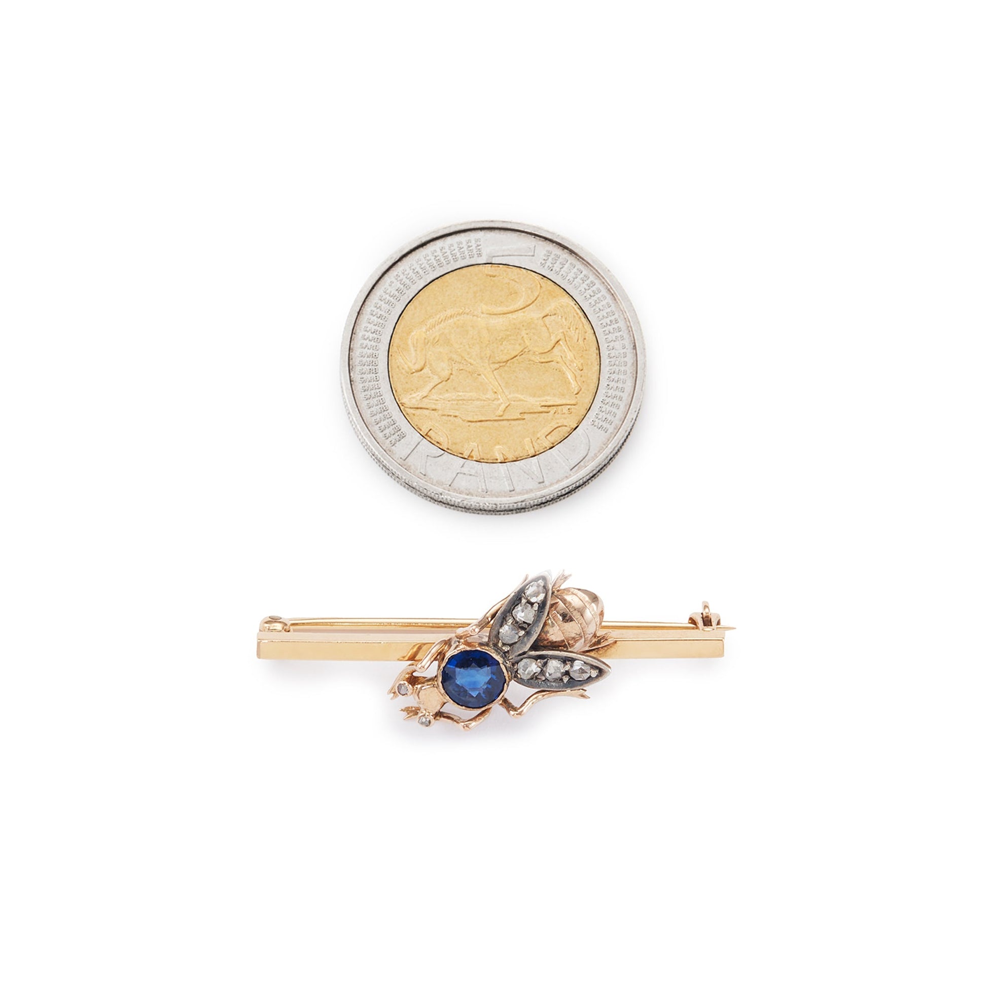 Charming 15ct yellow gold bar brooch featuring a quaint insect with a sapphire body and mine cut diamond eyes and wings.