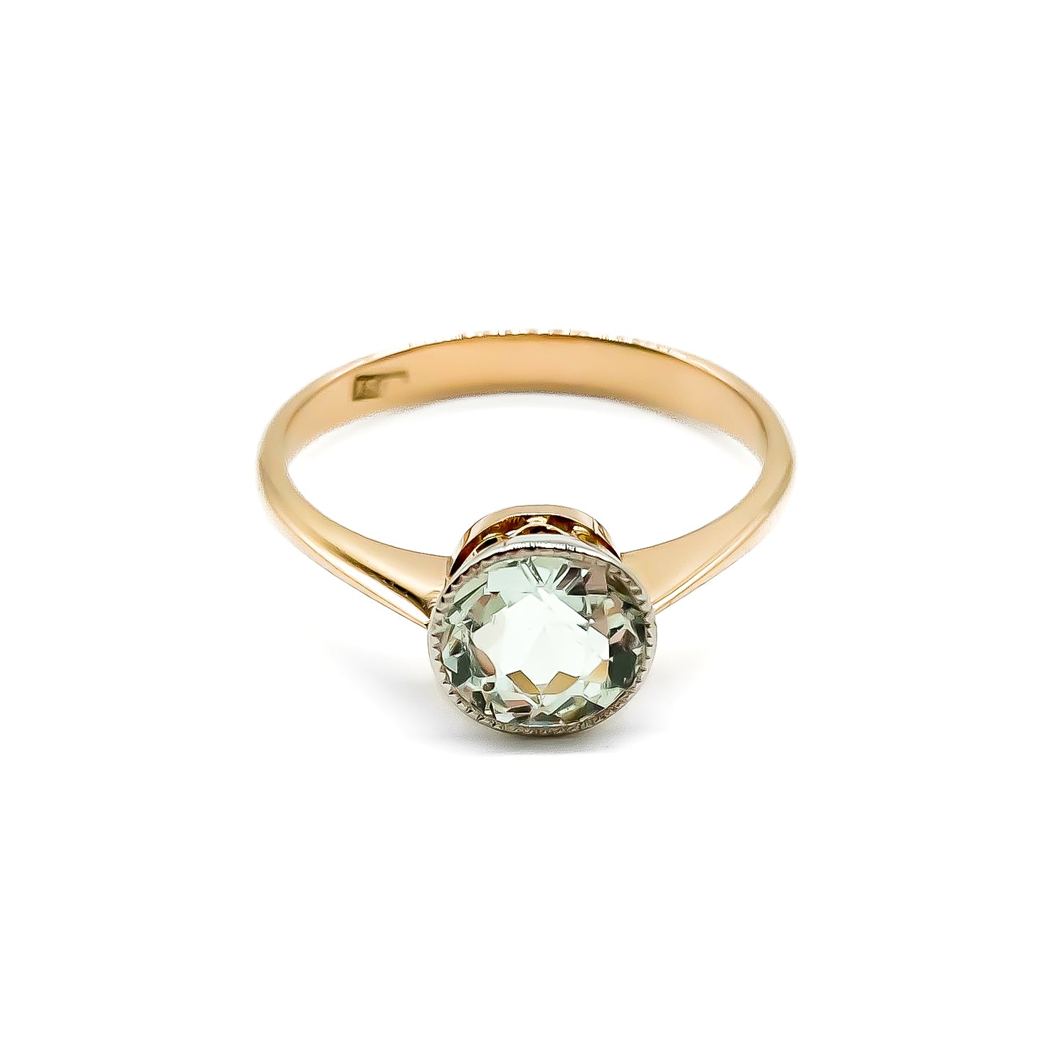 Stunning Edwardian rose gold ring with a round faceted sea blue aquamarine in a white and rose gold setting.