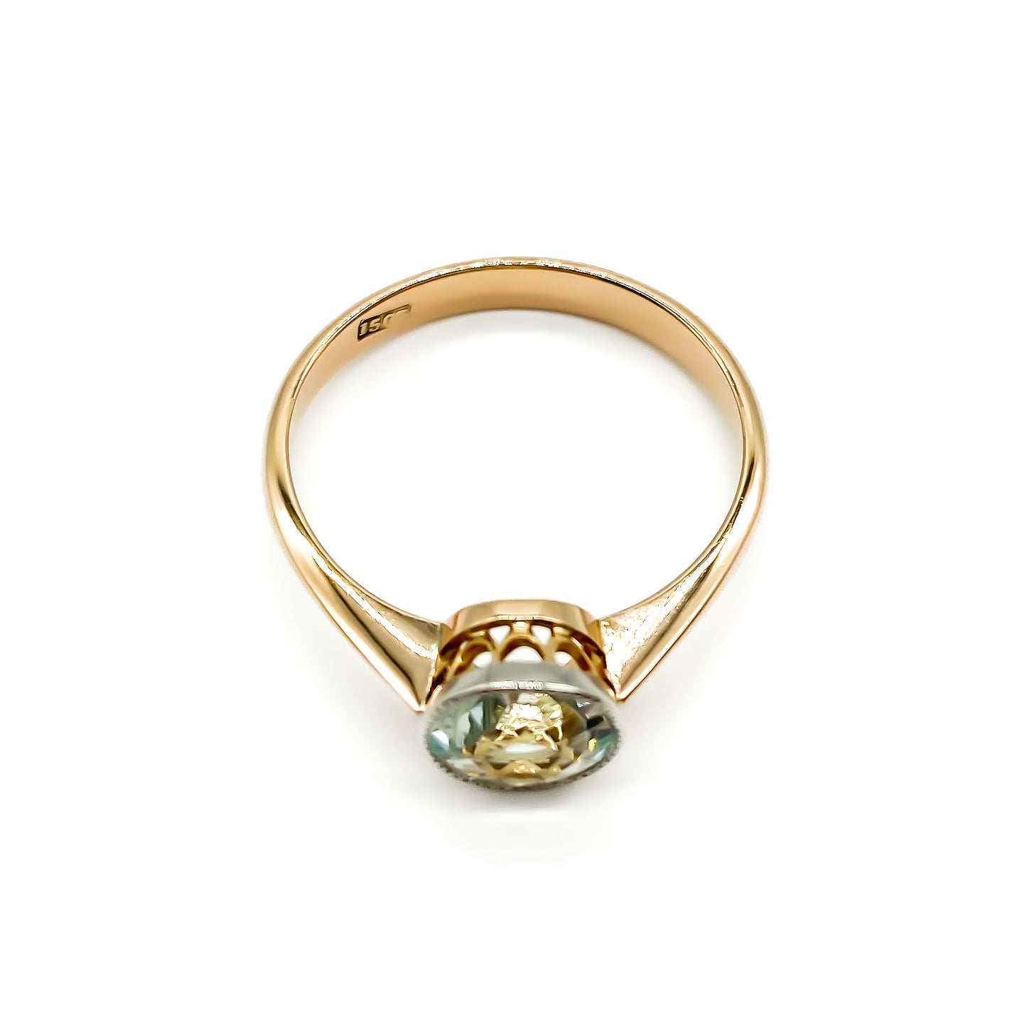 Stunning Edwardian rose gold ring with a round faceted sea blue aquamarine in a white and rose gold setting.
