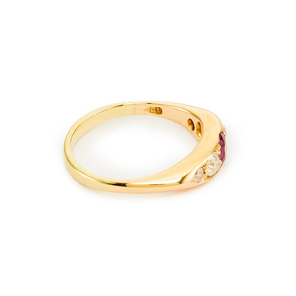 Classic Edwardian 18ct gold ring set with a beautiful centre 0.20ct ruby, with two natural, old-cut diamonds on each shoulder. Ideal for stacking.