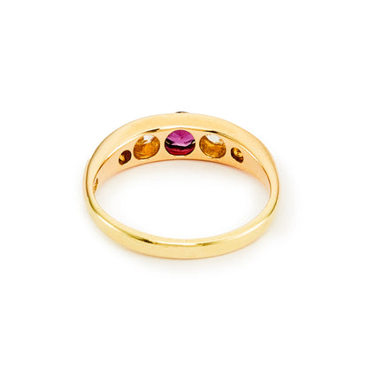 Classic Edwardian 18ct gold ring set with a beautiful centre 0.20ct ruby, with two natural, old-cut diamonds on each shoulder. Ideal for stacking.