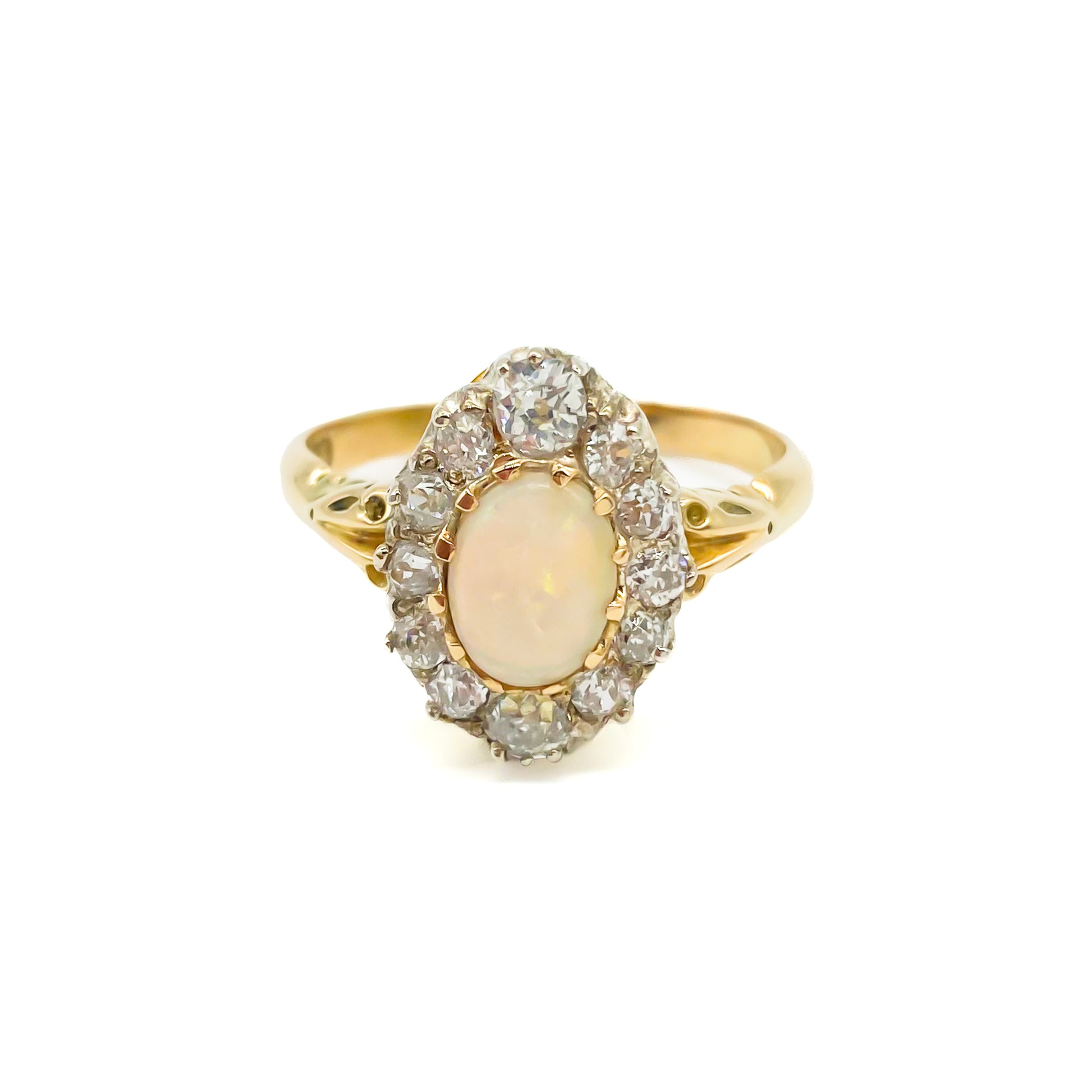 Beautiful Edwardian 18ct yellow gold ring set with an oval opal cabochon surrounded by twelve old-European-cut diamonds.