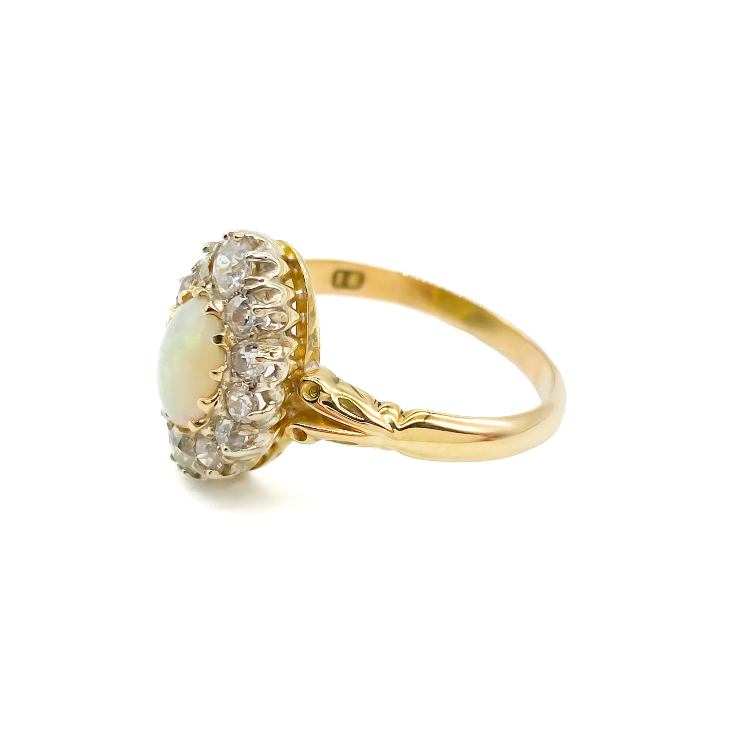 Beautiful Edwardian 18ct yellow gold ring set with an oval opal cabochon surrounded by twelve old-European-cut diamonds.