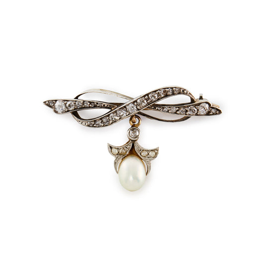 Exquisite Edwardian 18ct gold and silver bow brooch encrusted with old cut diamonds in varying sizes, with a pearl and diamond drop.