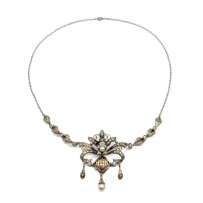 Intricate Edwardian 18ct gold and silver festoon necklace set with two cultured pearls and a variety of paste stones.