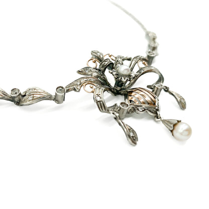 Intricate Edwardian 18ct gold and silver festoon necklace set with two cultured pearls and a variety of paste stones.