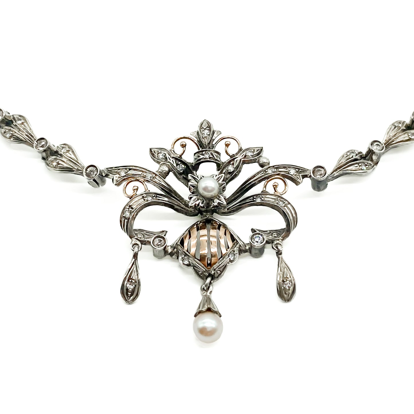 Intricate Edwardian 18ct gold and silver festoon necklace set with two cultured pearls and a variety of paste stones.