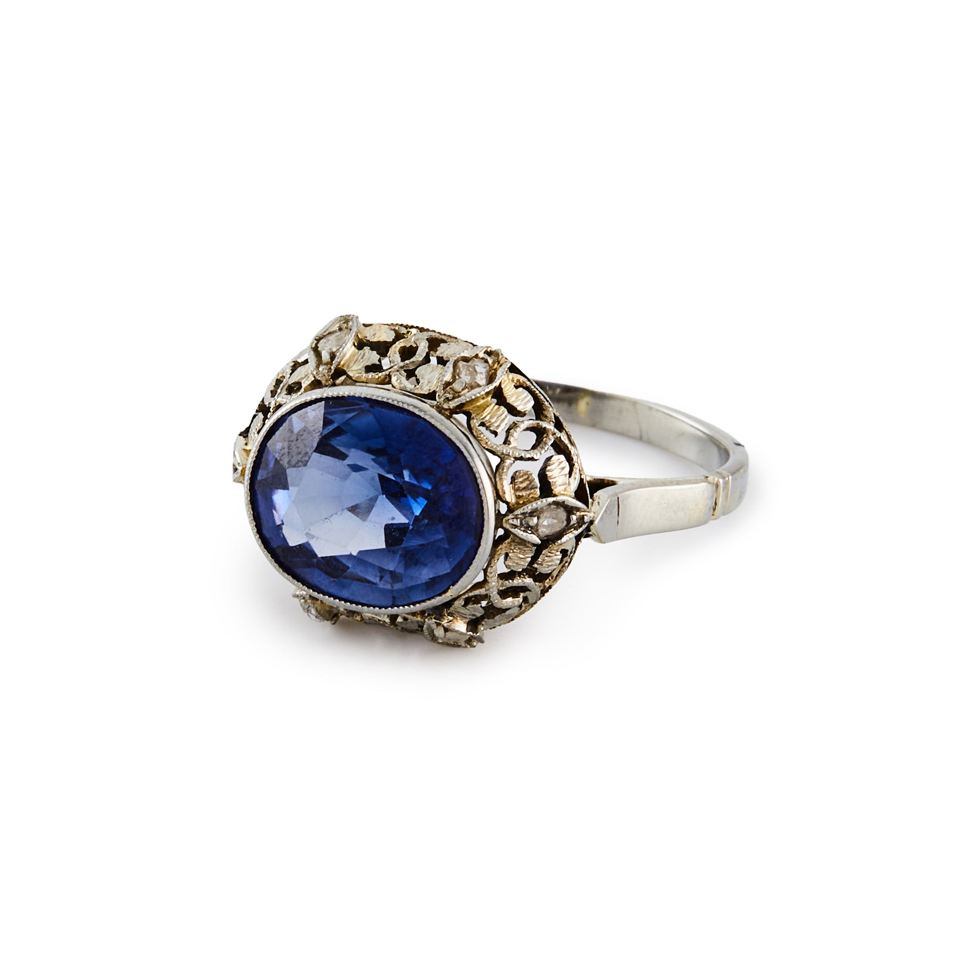 Stunning Edwardian 18ct white gold ring, set with a cornflower blue sapphire in an ornate setting, embellished by six tiny mine cut diamonds.