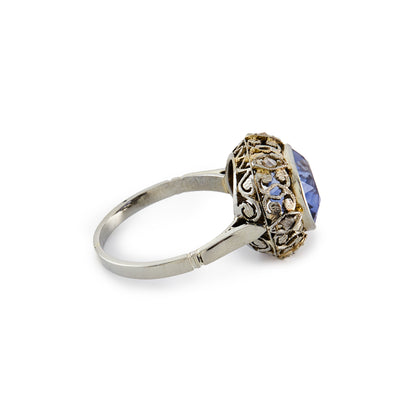 Stunning Edwardian 18ct white gold ring, set with a cornflower blue sapphire in an ornate setting, embellished by six tiny mine cut diamonds.