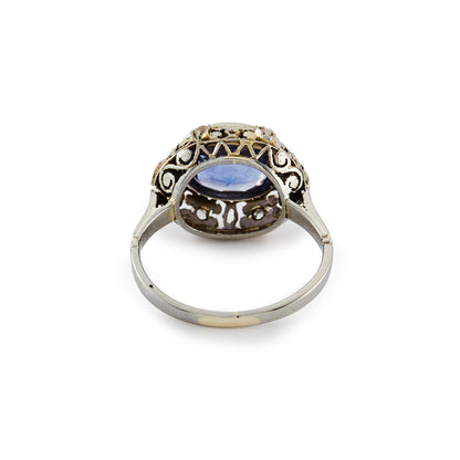 Stunning Edwardian 18ct white gold ring, set with a cornflower blue sapphire in an ornate setting, embellished by six tiny mine cut diamonds.