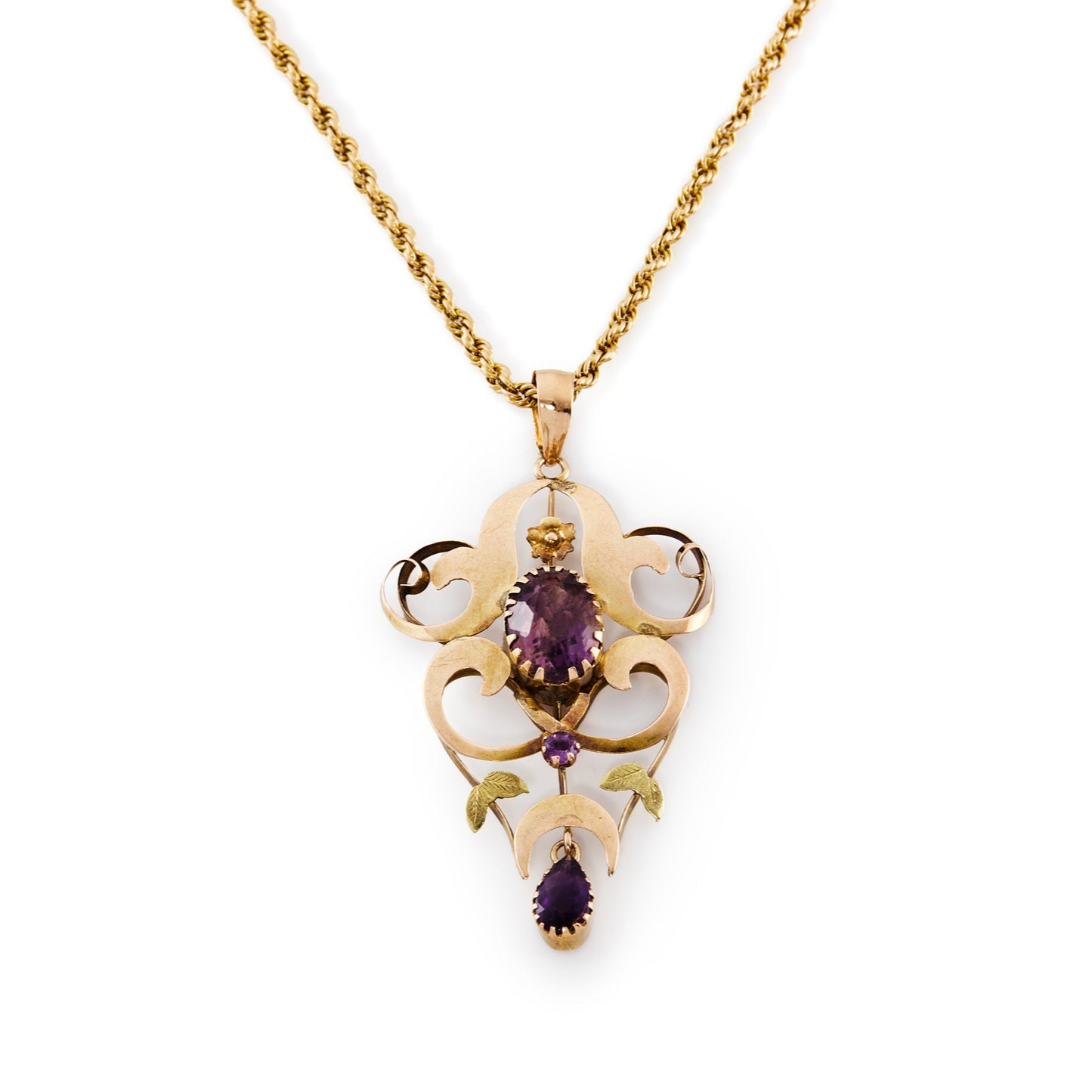 Beautiful Edwardian 9ct rose and yellow gold pendant, set with three faceted amethysts, on a 9ct gold rope chain with a barrel clasp.