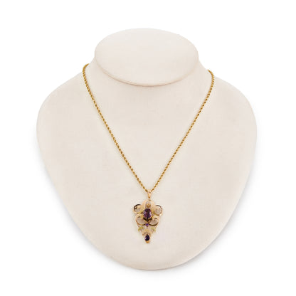 Beautiful Edwardian 9ct rose and yellow gold pendant, set with three faceted amethysts, on a 9ct gold rope chain with a barrel clasp.