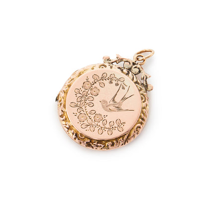 Pretty Edwardian 9ct gold back and front locket engraved with a swallow and flower design.