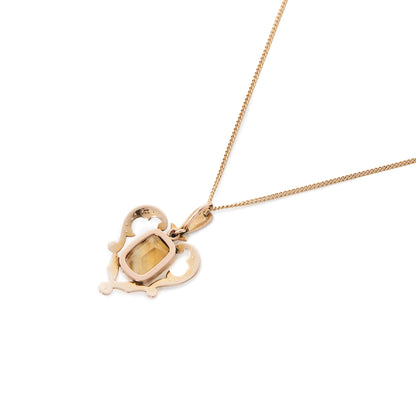 Gorgeous Edwardian 9ct gold pendant set with a beautiful cushion cut citrine surrounded by seed pearls. On a 9ct gold chain.