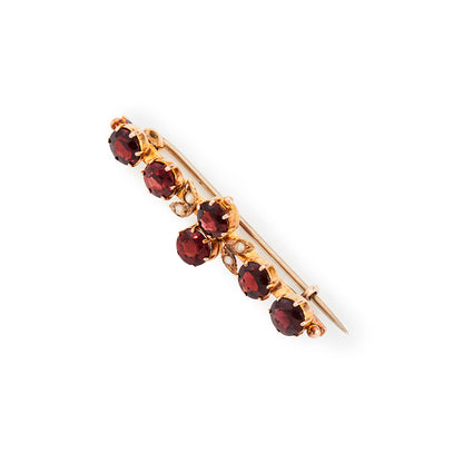 Pretty Edwardian 9ct gold bar brooch, set with six beautifully faceted garnets and four seed pearls. Chester 1910