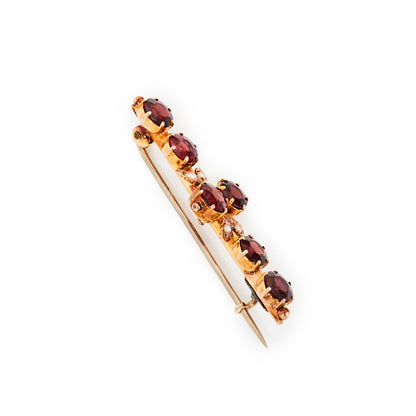 Pretty Edwardian 9ct gold bar brooch, set with six beautifully faceted garnets and four seed pearls. Chester 1910