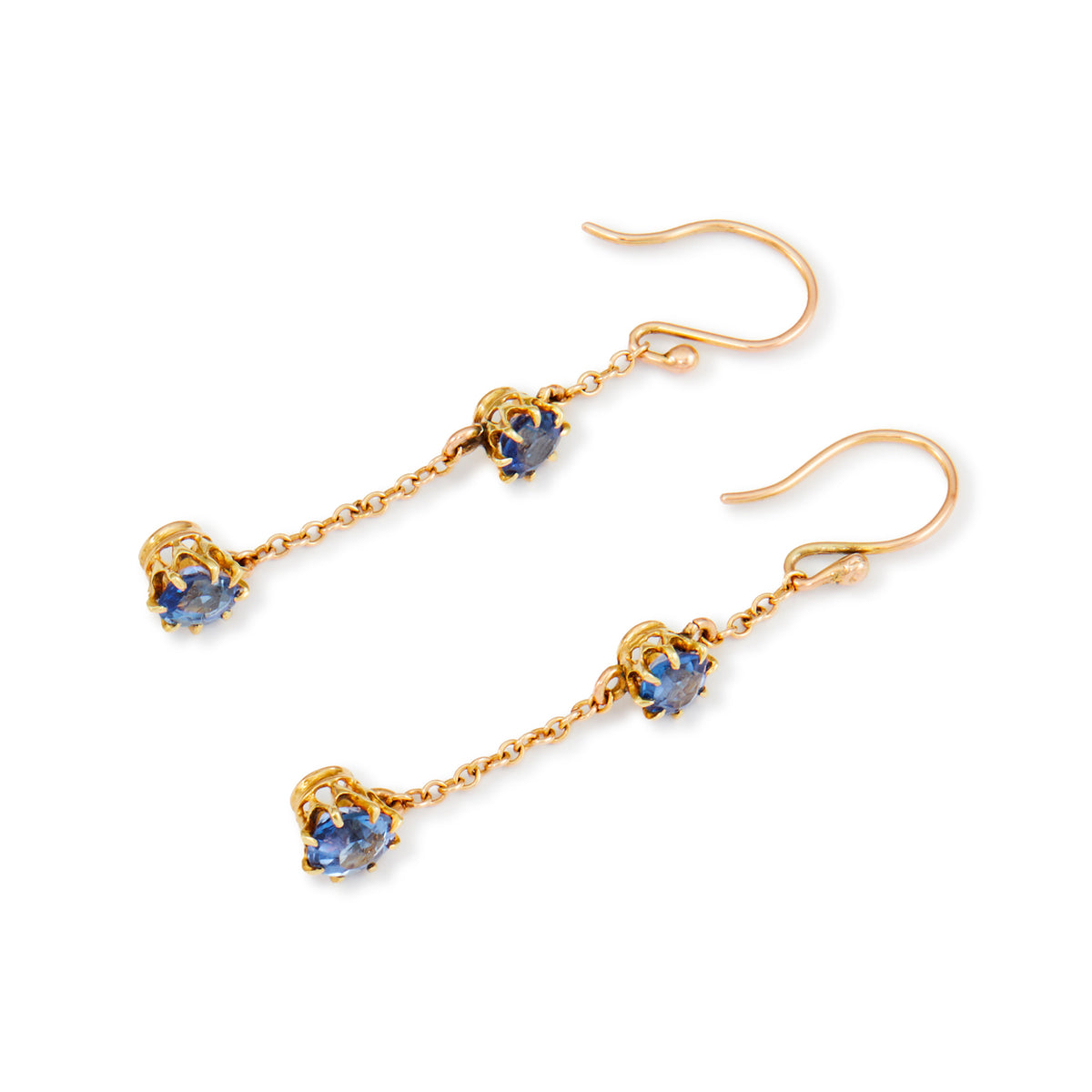 Exquisite 9ct gold Edwardian dangly earrings, each set with two beautifully faceted, cornflower blue sapphires.