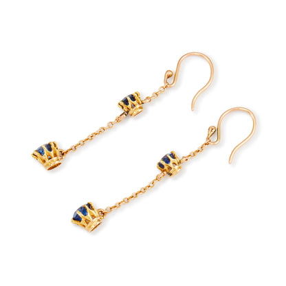 Exquisite 9ct gold Edwardian dangly earrings, each set with two beautifully faceted, cornflower blue sapphires.