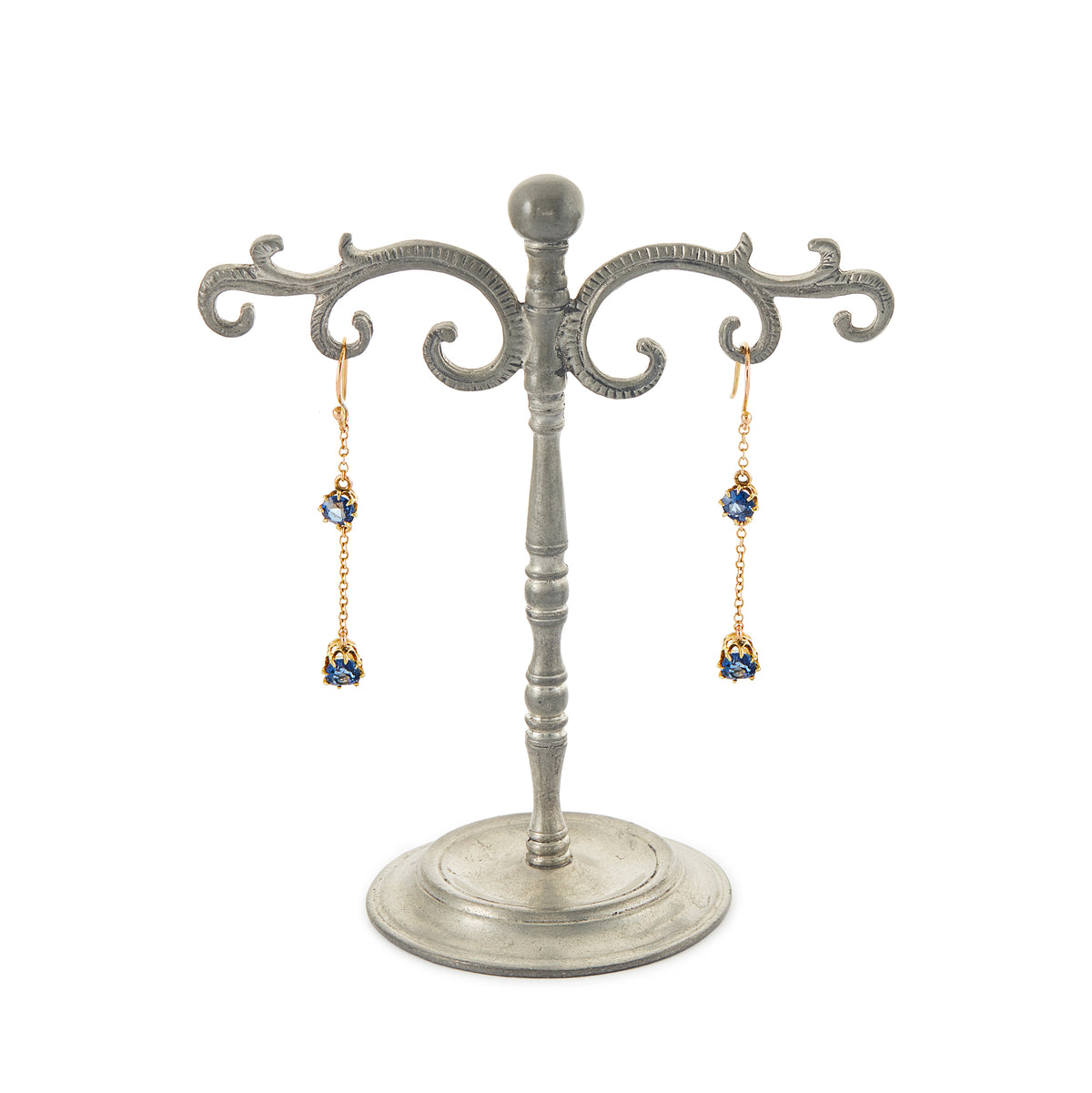Exquisite 9ct gold Edwardian dangly earrings, each set with two beautifully faceted, cornflower blue sapphires.