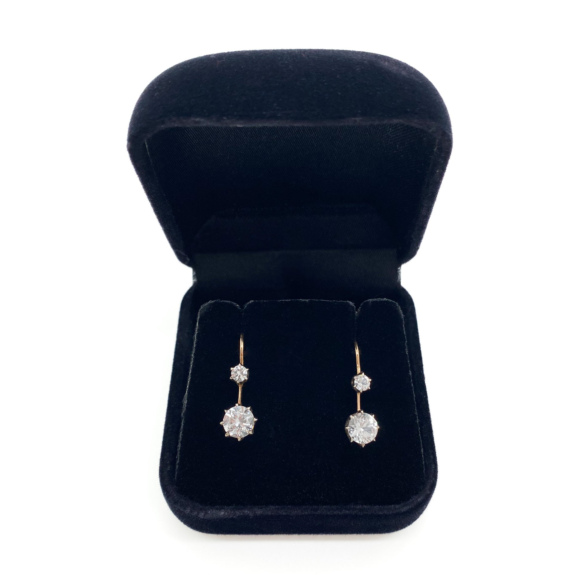 Classic Edwardian 9ct gold drop earrings, each set with two synthetic spinel stones.