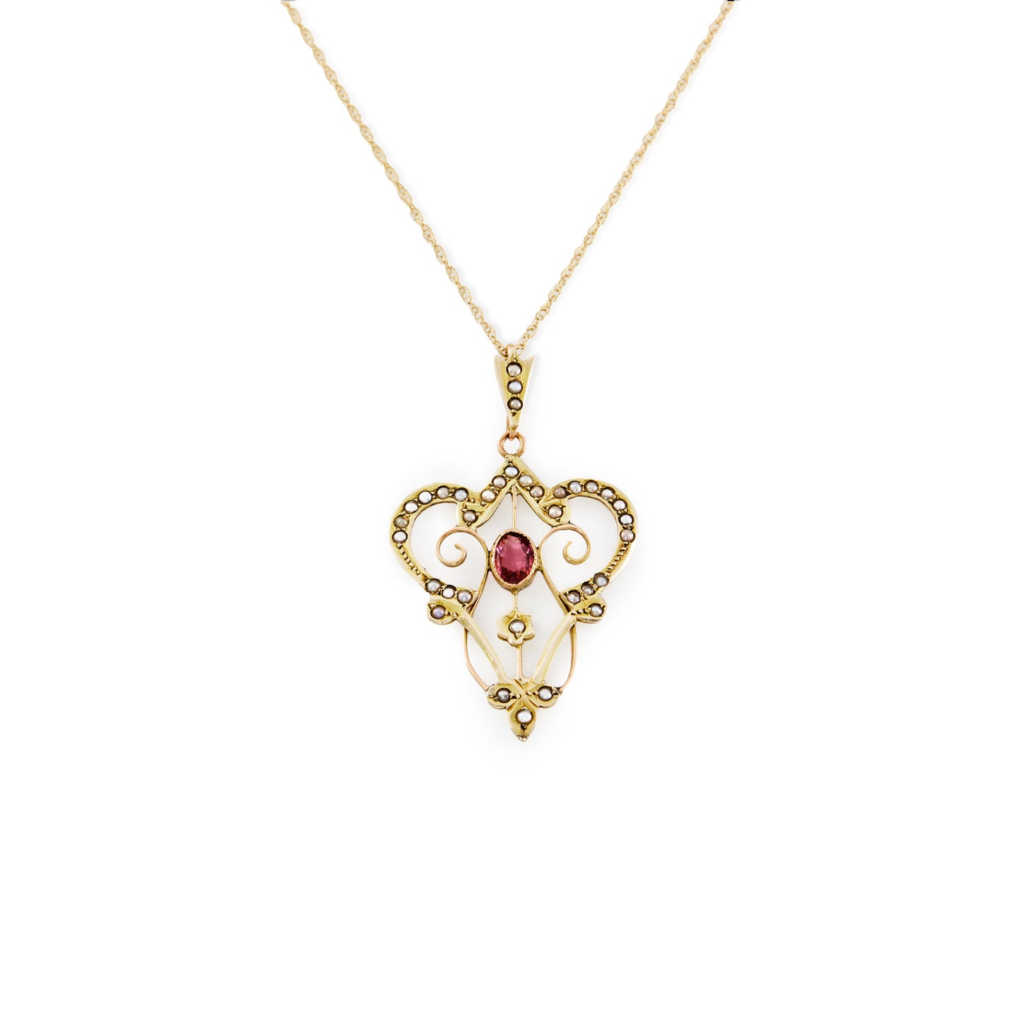 Feminine Edwardian 9ct gold, pink tourmaline and seed pearl pendant with intricate detail, on a 9ct gold chain.