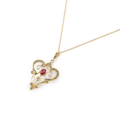 Feminine Edwardian 9ct gold, pink tourmaline and seed pearl pendant with intricate detail, on a 9ct gold chain.