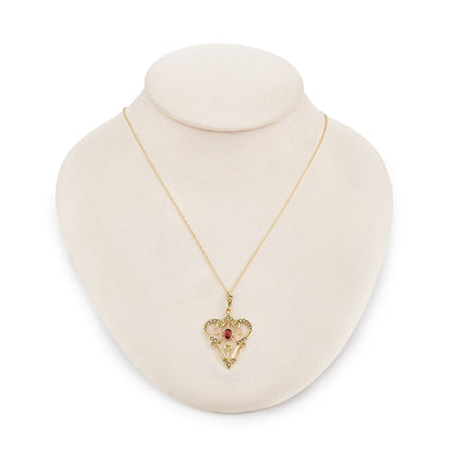 Feminine Edwardian 9ct gold, pink tourmaline and seed pearl pendant with intricate detail, on a 9ct gold chain.