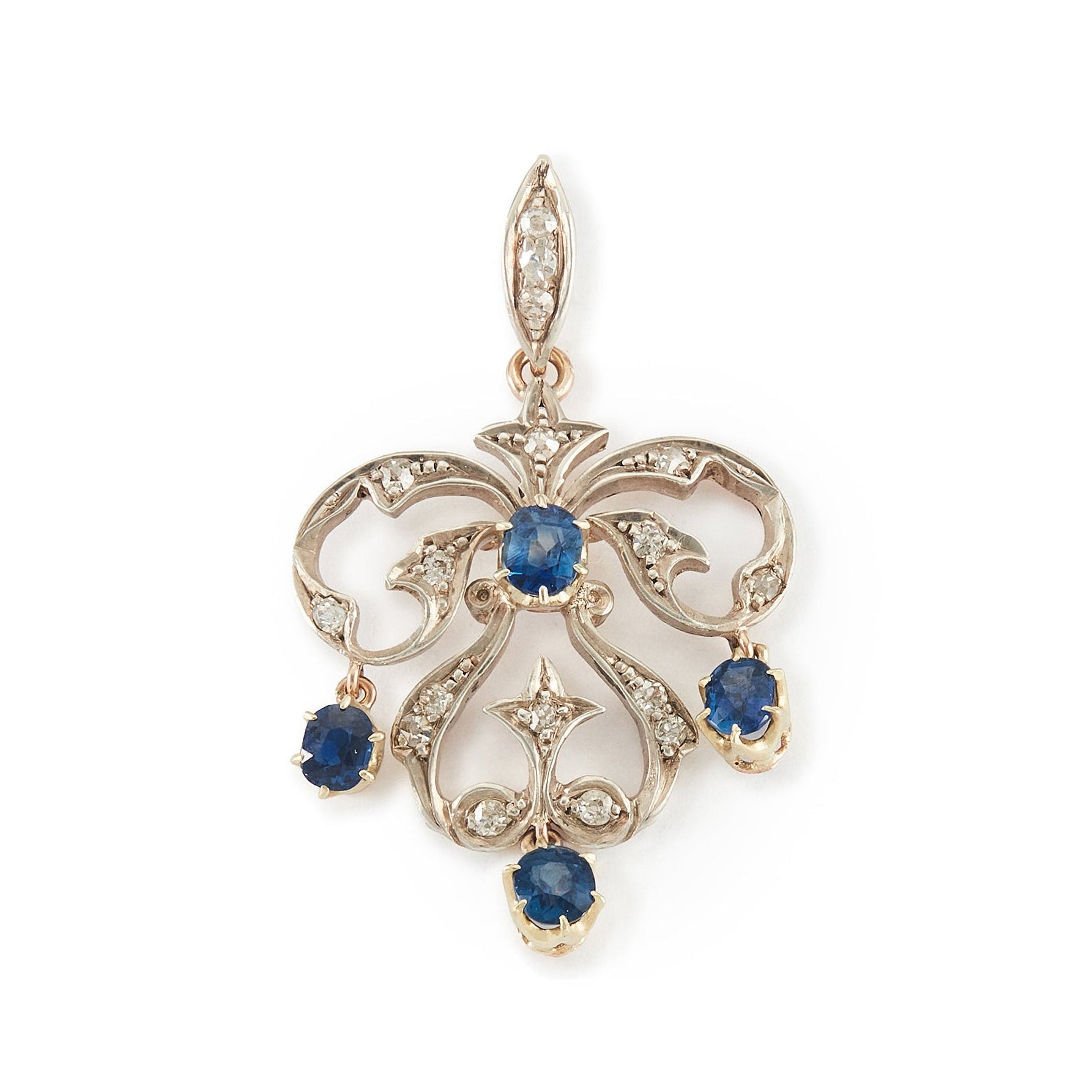 Exquisite Edwardian 9ct gold and silver pendant set with four bright blue sapphires and seventeen small old-cut diamonds.