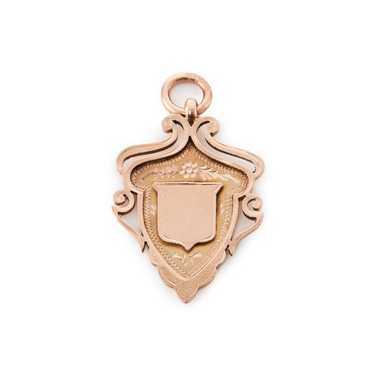 Beautifully engraved Edwardian 9ct rose gold shield shaped medallion.