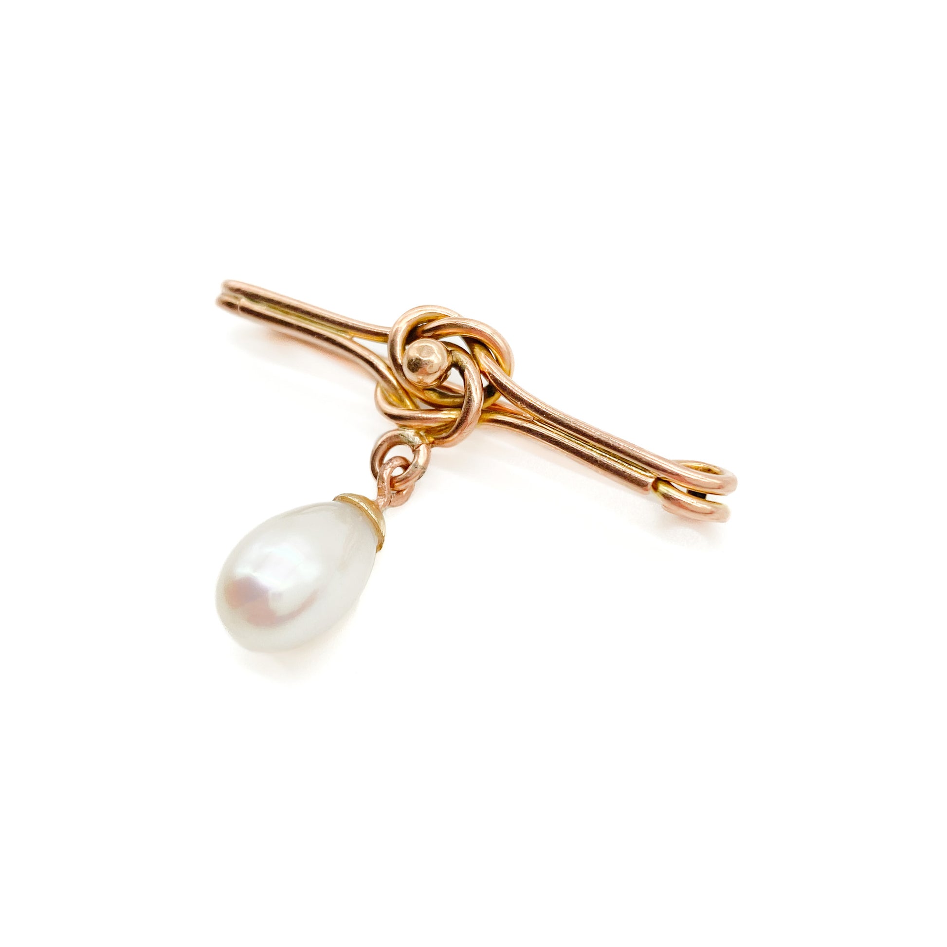 Classic Edwardian 9ct rose gold brooch with a celtic knot design and a dangling teardrop pearl.