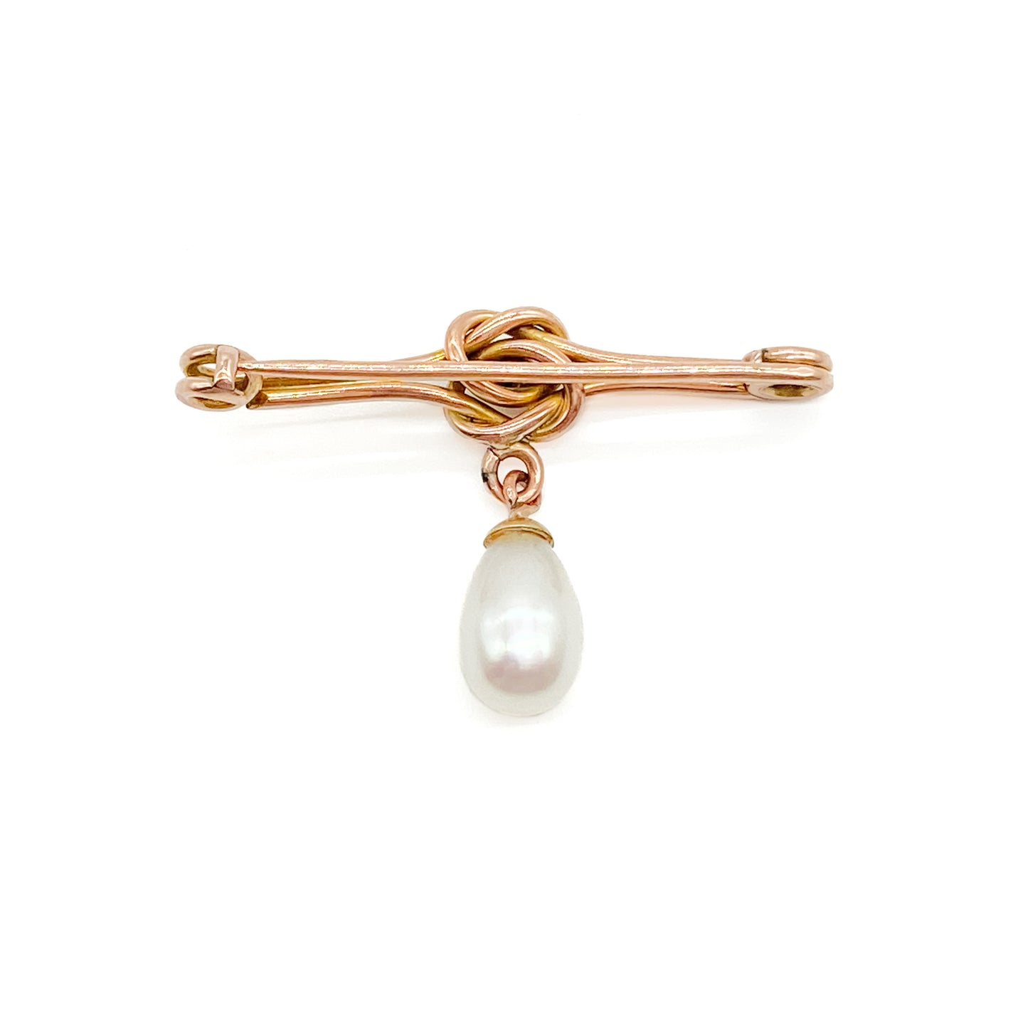 Classic Edwardian 9ct rose gold brooch with a celtic knot design and a dangling teardrop pearl.