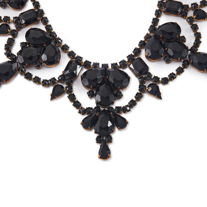Glamorous Edwardian Czechoslovakian black faceted glass festoon necklace on a base metal backing. Adjustable length. A real statement piece for a special occasion!