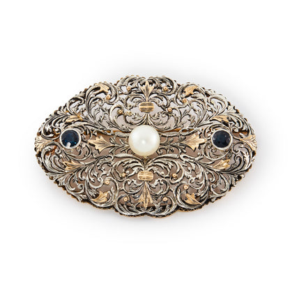 Impressive Edwardian filigree rose gold and silver brooch set with two deep blue faceted sapphires and one large cultured pearl.