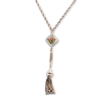 Pretty Edwardian silver albertina necklace with a beautifully enamelled diamond-shaped disc depicting a bouquet of flowers. The disc also has intricate floral engraving at the back. The albertina has a dangling tassel drop.