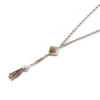 Pretty Edwardian silver albertina necklace with a beautifully enamelled diamond-shaped disc depicting a bouquet of flowers. The disc also has intricate floral engraving at the back. The albertina has a dangling tassel drop.
