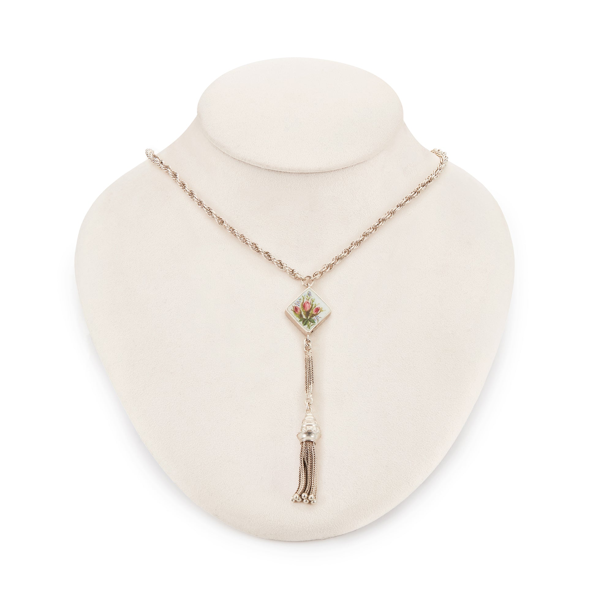 Pretty Edwardian silver albertina necklace with a beautifully enamelled diamond-shaped disc depicting a bouquet of flowers. The disc also has intricate floral engraving at the back. The albertina has a dangling tassel drop.