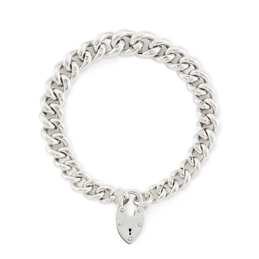Chunky Edwardian sterling silver charm bracelet with graduated curb links and a sterling silver padlock.