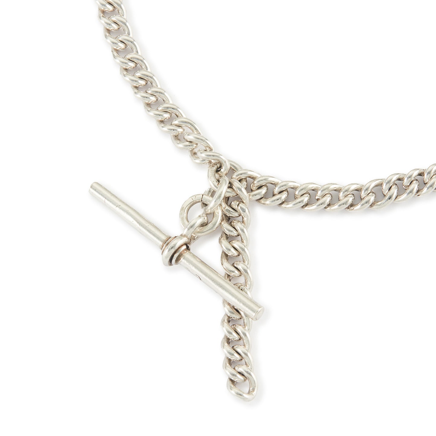 Classic Edwardian Sterling silver curb link fob chain with two dog-clips and a T-bar. There is a piece of chain attached allowing the chain to be lengthened or to attach a medallion or fob. Every link is stamped.