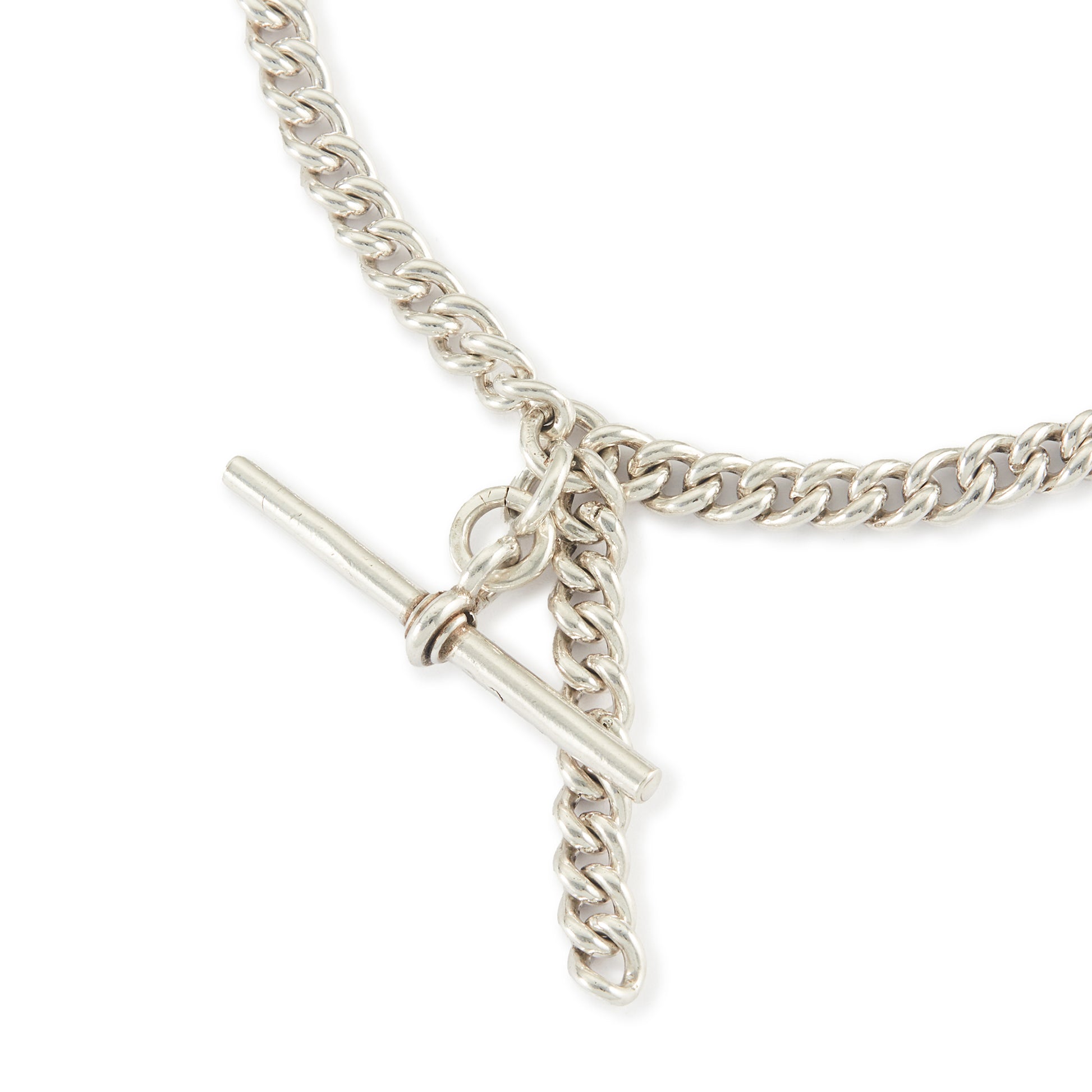 Classic Edwardian Sterling silver curb link fob chain with two dog-clips and a T-bar. There is a piece of chain attached allowing the chain to be lengthened or to attach a medallion or fob. Every link is stamped.