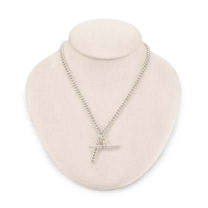 Classic Edwardian Sterling silver curb link fob chain with two dog-clips and a T-bar. There is a piece of chain attached allowing the chain to be lengthened or to attach a medallion or fob. Every link is stamped.